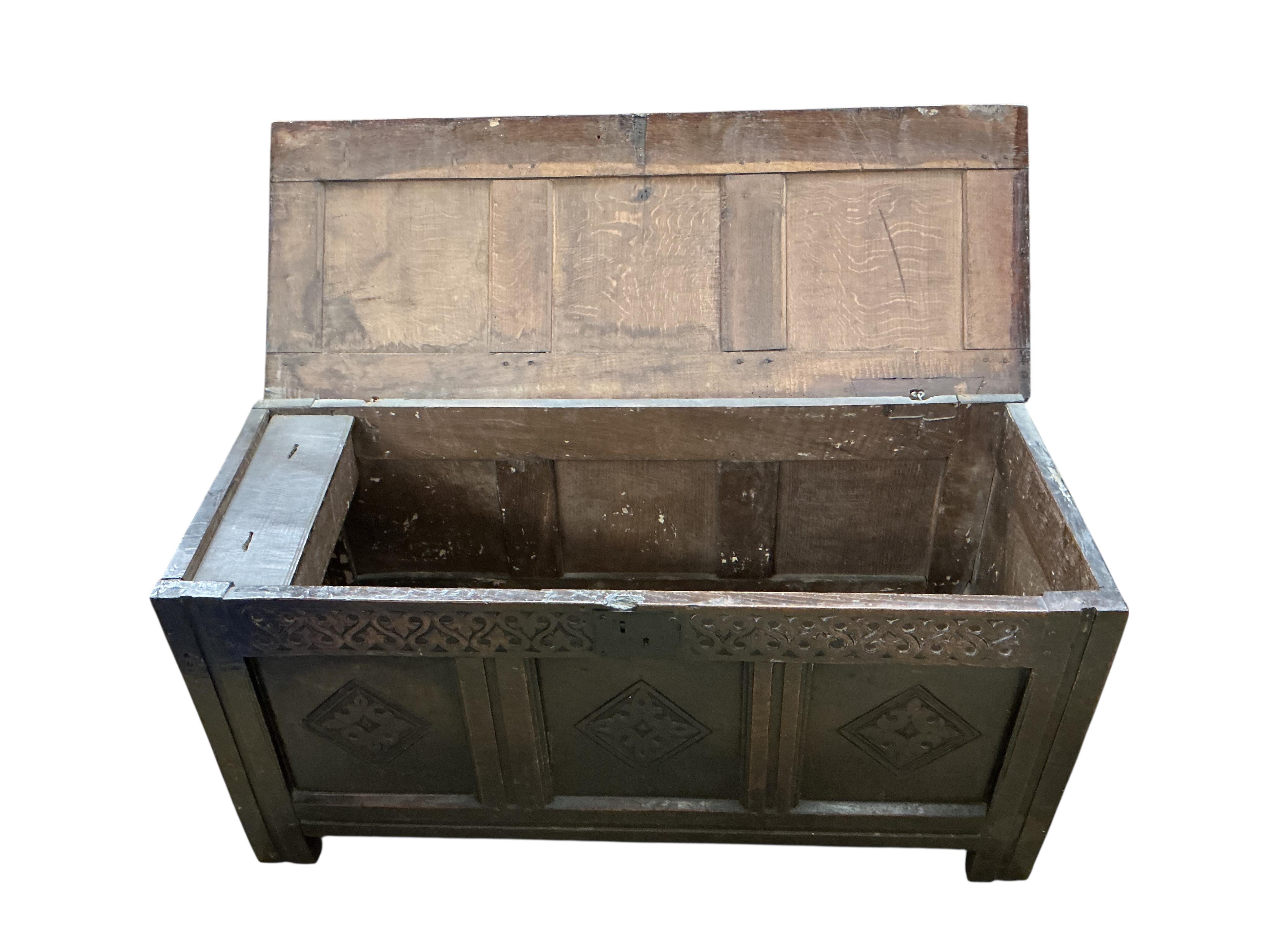 A late 17th century oak triple panelled coffer, width 116cm, depth 44cm, height 58cm